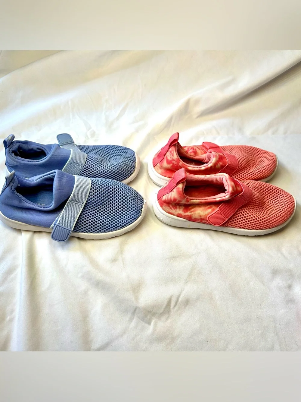 Two pairs of Kids Slip-On Mesh water shoes in Blue and Coral